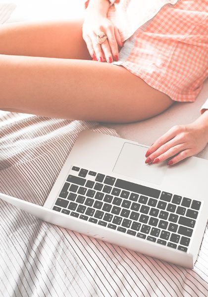 Macbook on a bed